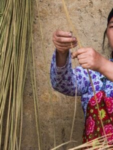Handmade Moroccan Basket: What Stories Does It Hold? Woman weaving Handmade Moroccan Basket